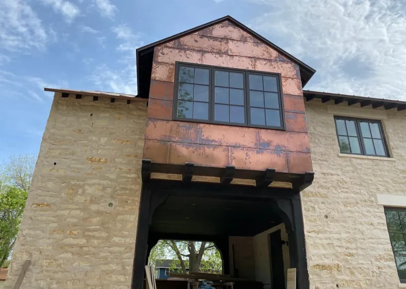 Copper metal panel facade on a stone building for Skylight Installation in Odenton